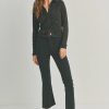 Black cropped jacket with cropped flare denim and loafers for a chic slim fit look