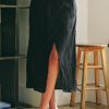 Black midi skirt with side slit and textured fabric for women’s boho chic clothing