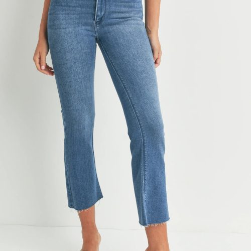 Cropped flare denim jeans with raw hem in medium blue wash for a slim fit style