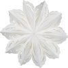 Delicate white paper snowflake ornament with intricate cut-out design for holiday decor