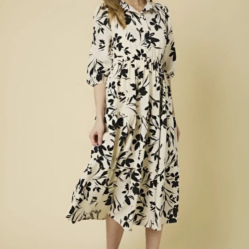 Elegant button down tiered floral print dress with three-quarter sleeves and a flowy silhouette