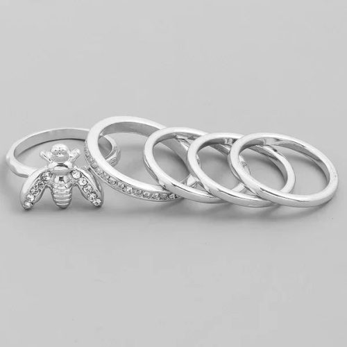 Set of five silver-toned stackable rings, including a bee ring with crystal accents