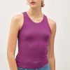 Sleeveless purple BASIC ROUND NECK TANK paired with stylish blue jeans for a casual look