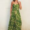 Strapless maxi dress with vibrant green tropical leaf print for a boho chic look