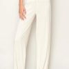 White woven textured wide leg pants with a drawstring waist for stylish comfort