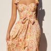 Woman in a floral print SUMMER DRESS, featuring a corset top design, SUNNY DAYS MAXI DRESS