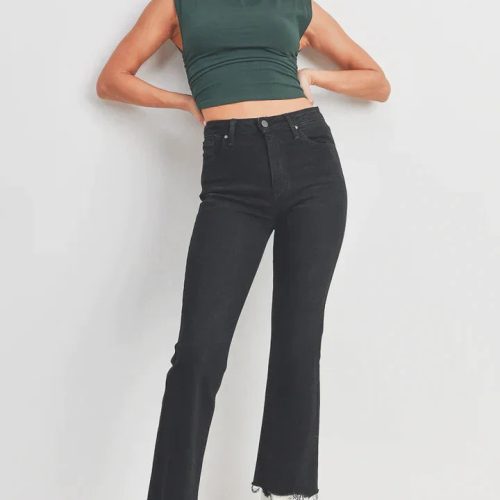 Woman in green crop top and black jeans showcasing Vintage Cropped Flare Denim